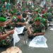 Ketika Tangan Seribu Tentara Membatik di Tugu Yogyakarta MOJOK.CO
